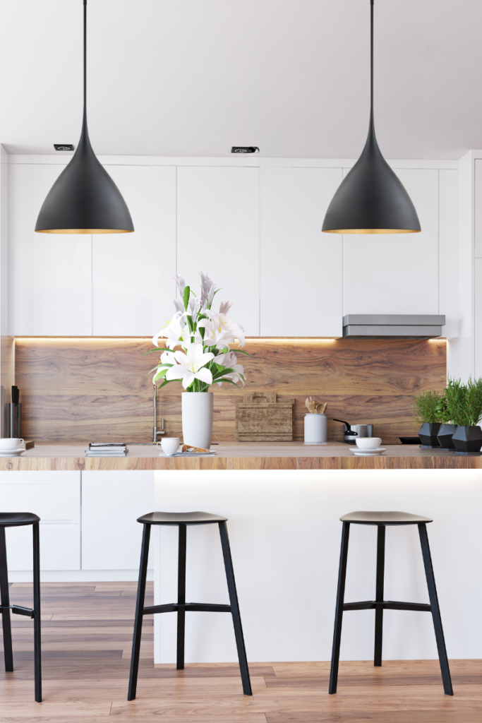 Innovative lighting ideas to transform your home. Soft and curved design of these pendants make the entire kitchen look more elevated and brings the 'designer" sense in space.